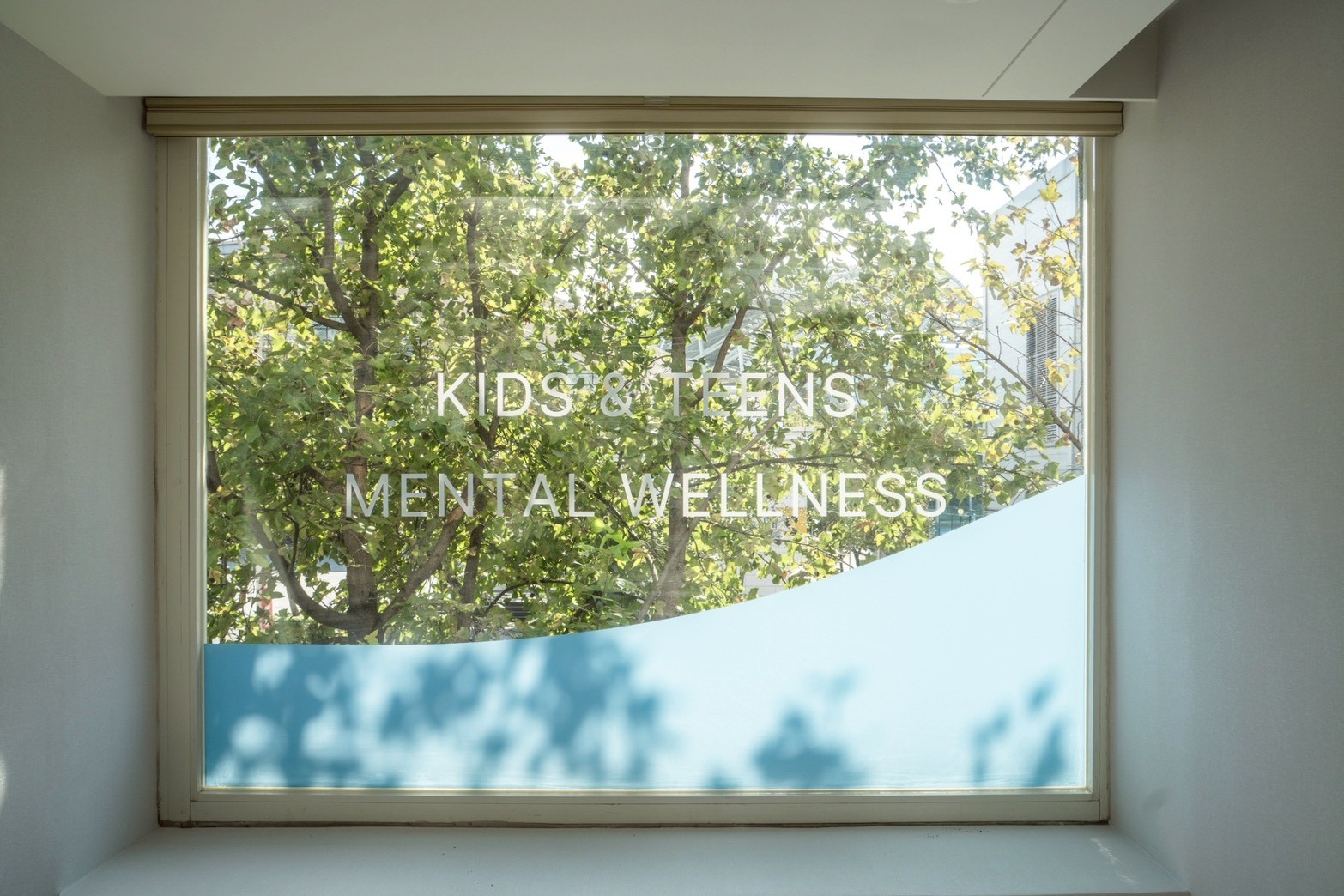 Parents and children sitting around a table working together