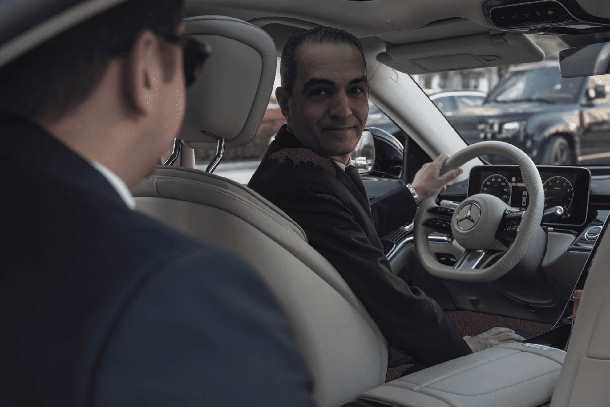 A chauffeur having a conversation with a client