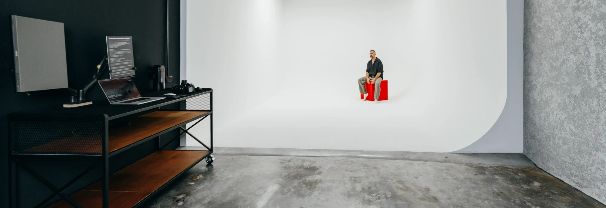 Studio 60 white cyclorama and tech desk, wide angle
