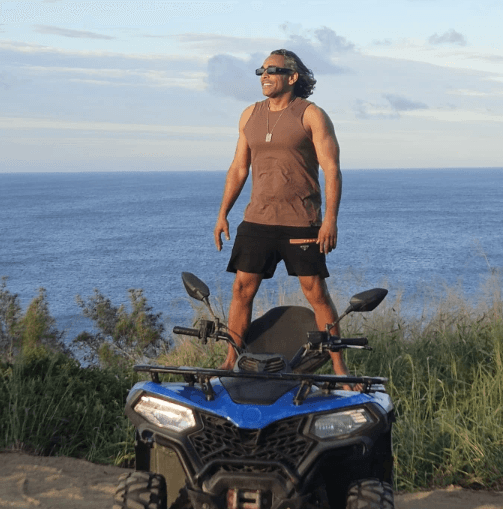 two ladies looking at a laptop and smiling