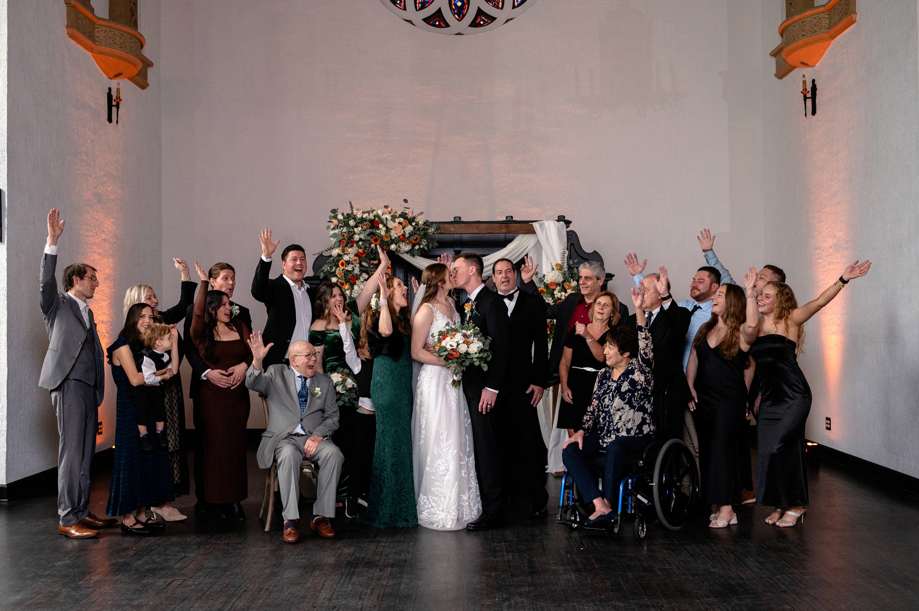 Flat lay wedding details with bouquet, rings, and sparkling bridal heels