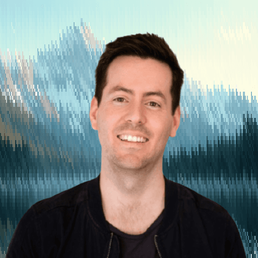 Professional headshot of a man smiling against a scenic background.