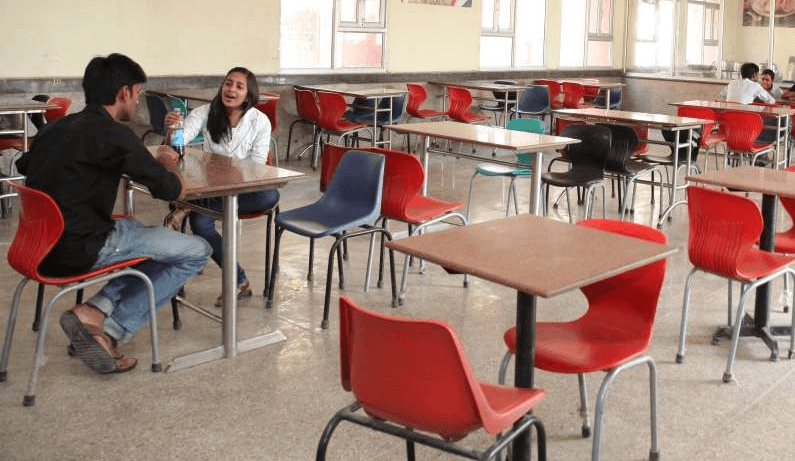 brown wooden pedestal table and chairs
