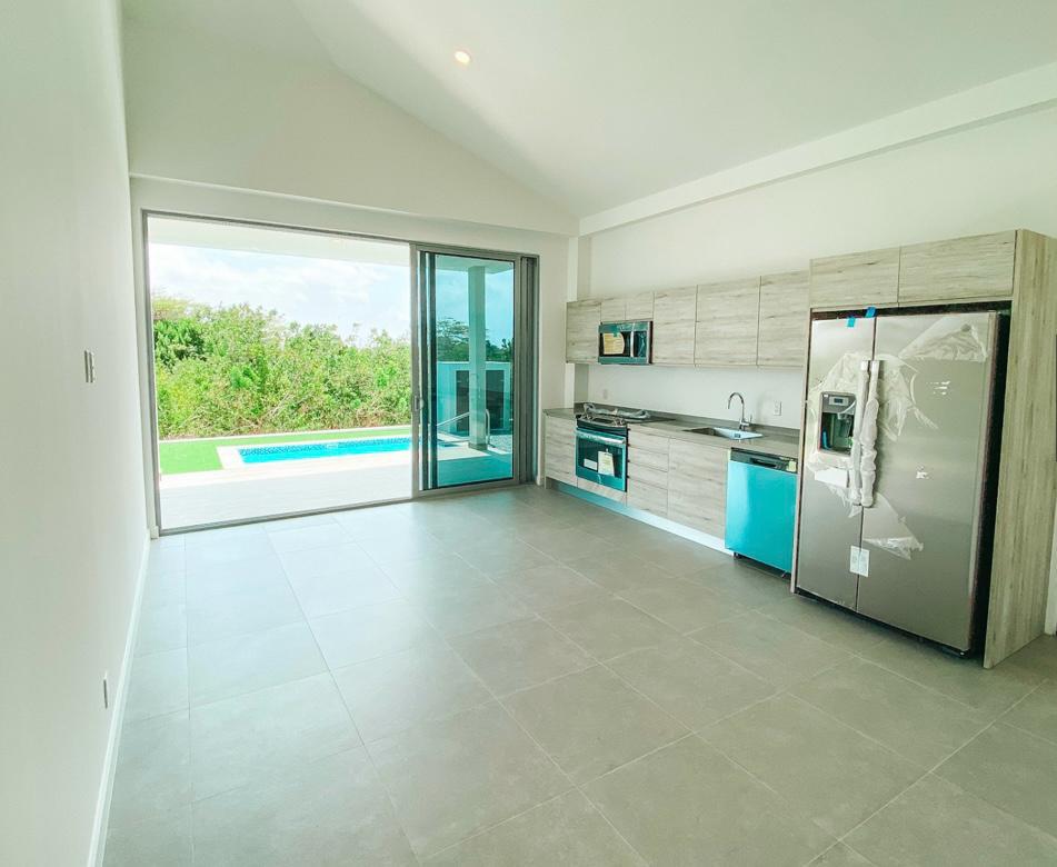 Azure Residences Main living room and kitchen before