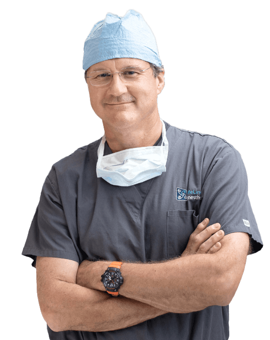 LifeLinc anesthesia provider in scrubs with arms crossed