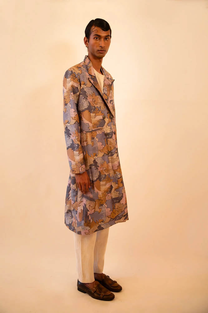 Ved is our one-of-a-kind double-breasted silk trench coat, handcrafted by skilled artisans in-house using a vintage silk sari.