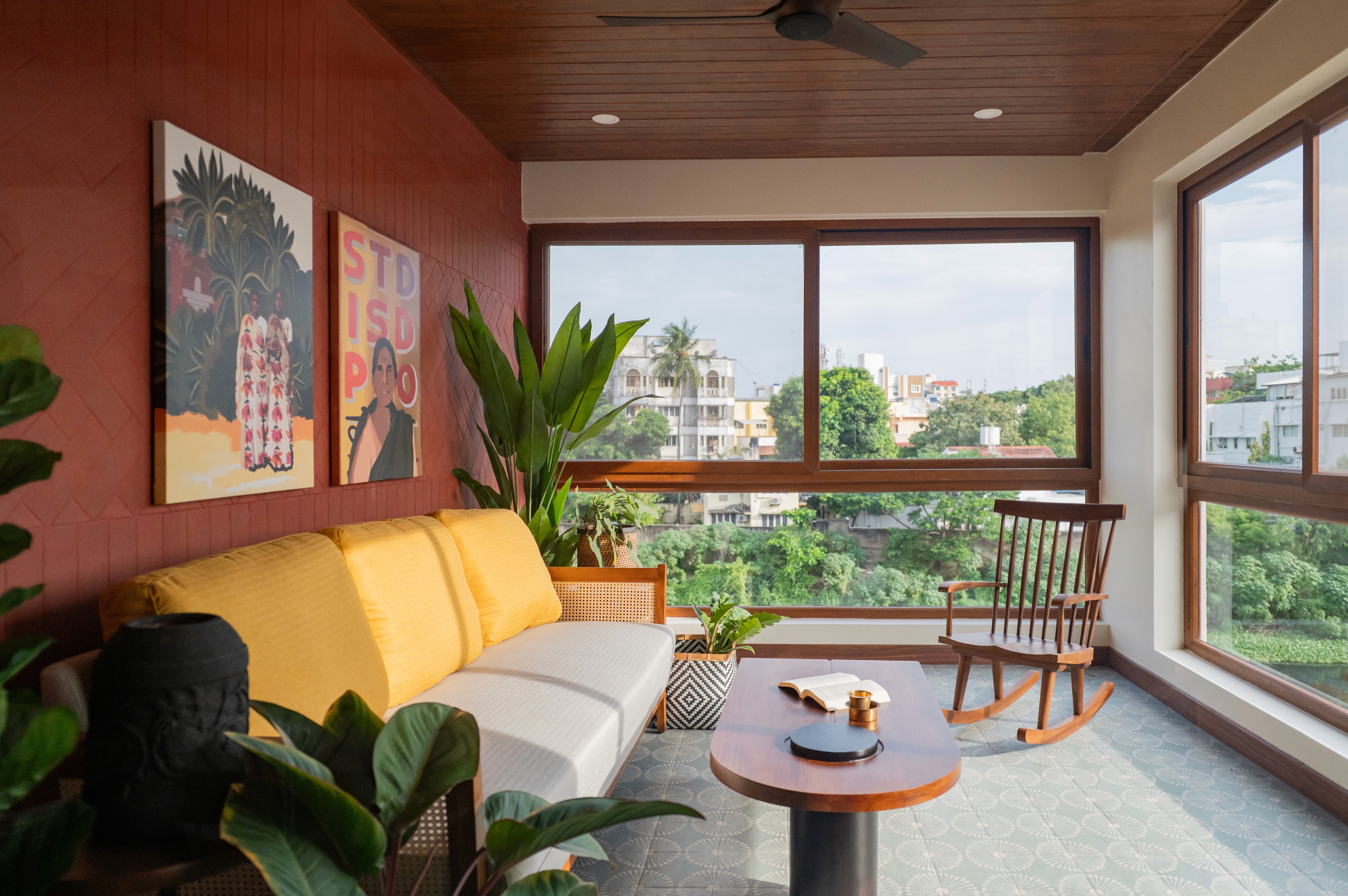 Modern commercial space with a slanted roof, surrounded by greenery and a spacious outdoor area.