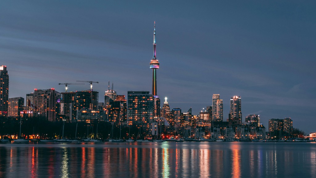 A city skyline next to a body of water