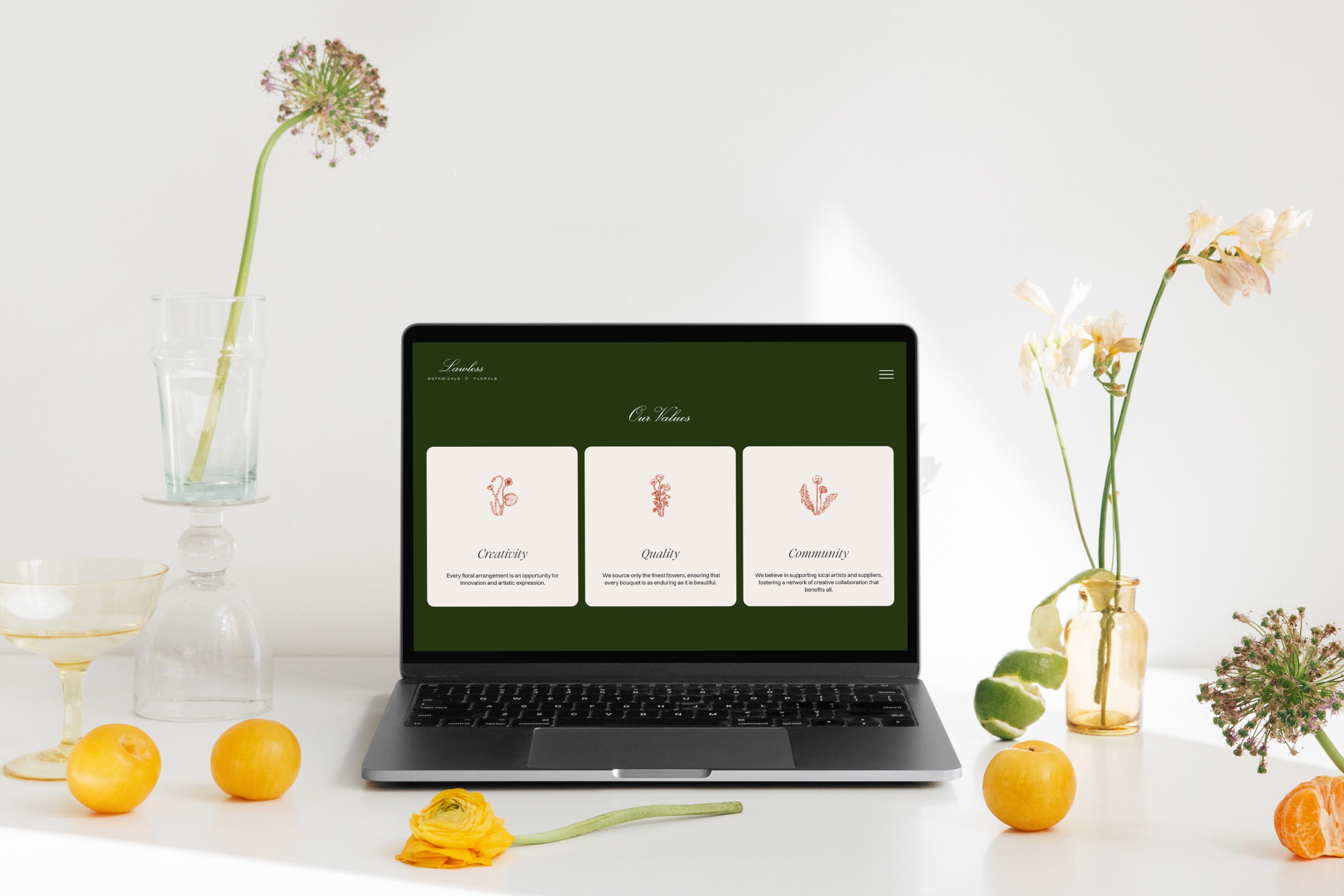 Lawless Botanicals & Florals website design displayed on a laptop, showcasing the brand’s values of creativity, quality, and community.