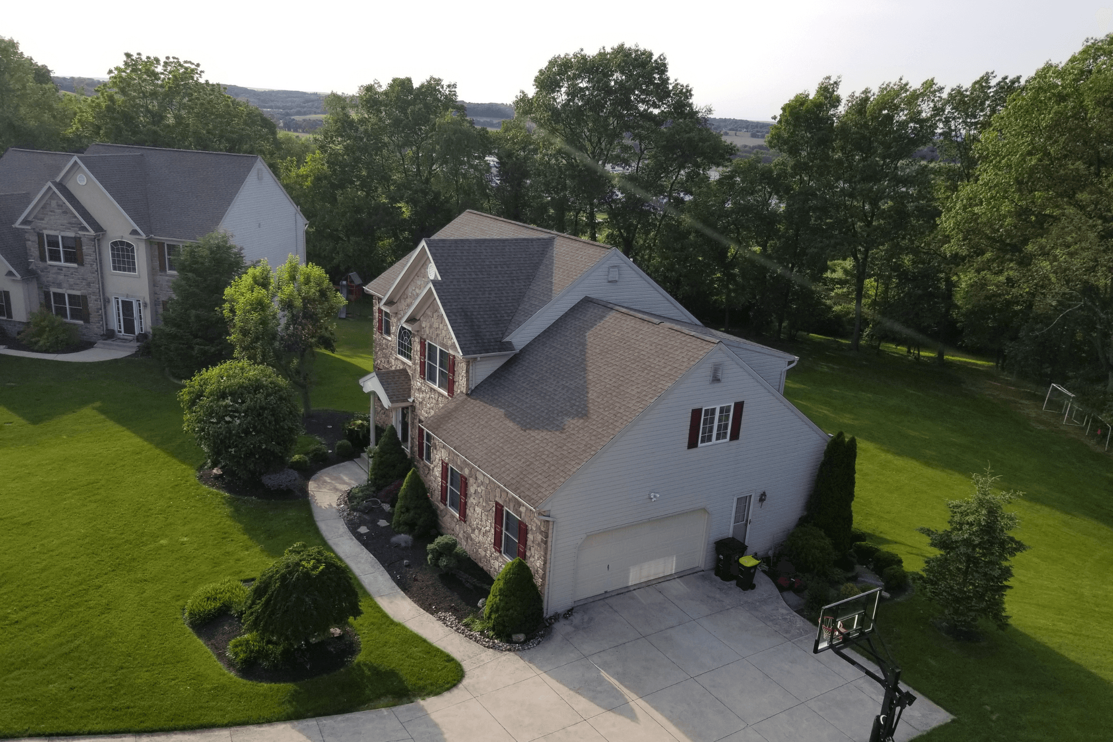 Drone shot of house with new roof installed with GAF Weatheredwood