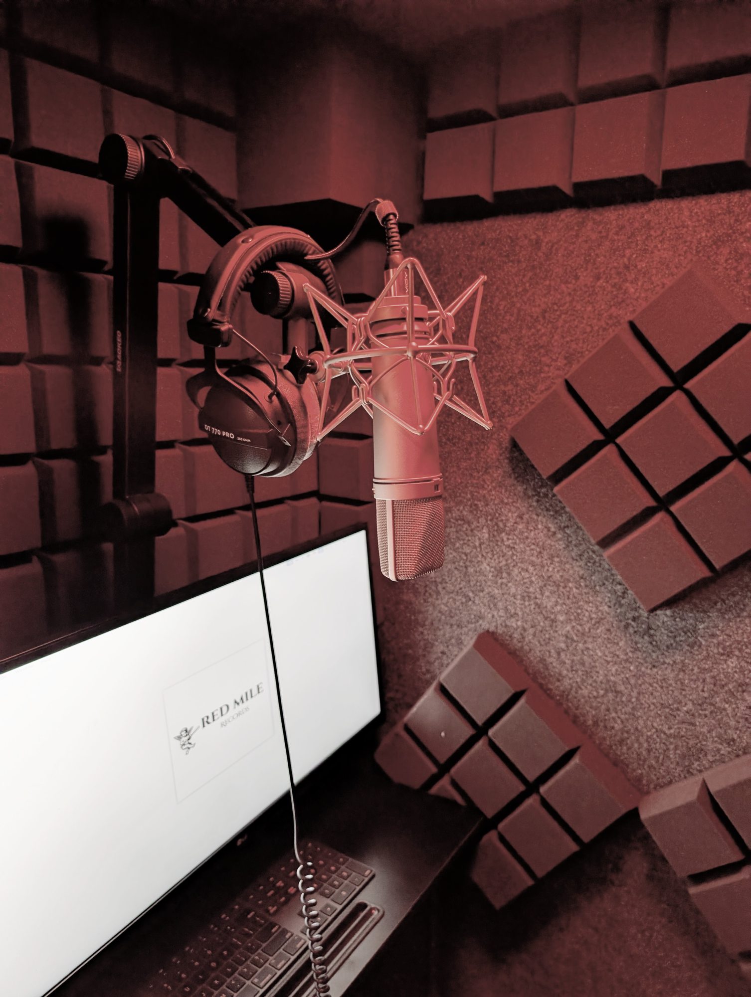 Soundproof acoustic vocal booth for song recording and podcasting at Red Mile Records in Calgary.
