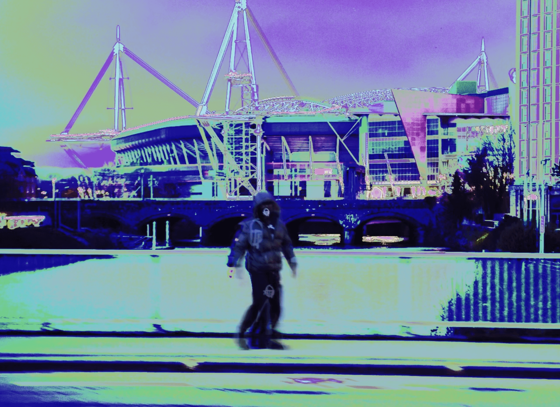 A film director sits in a chair facing a bustling, warmly lit night market scene. A camera setup is nearby, capturing the energetic atmosphere.