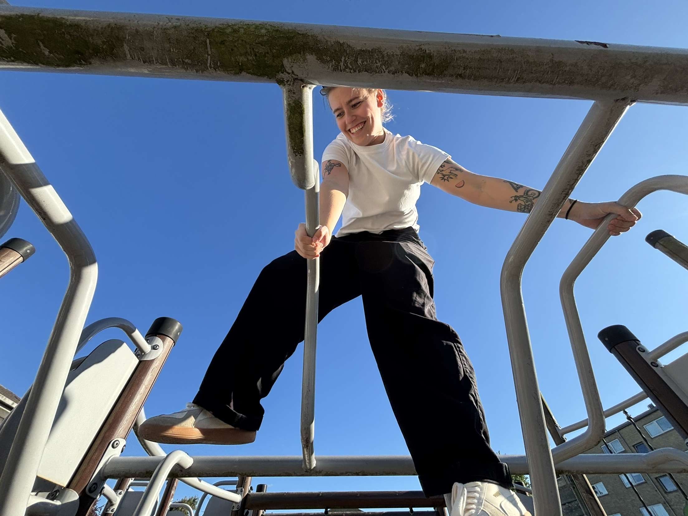 Portrait of man looking to the left and smiling with a dark background