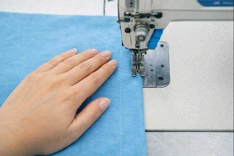 employee who works on the knitting machine.
