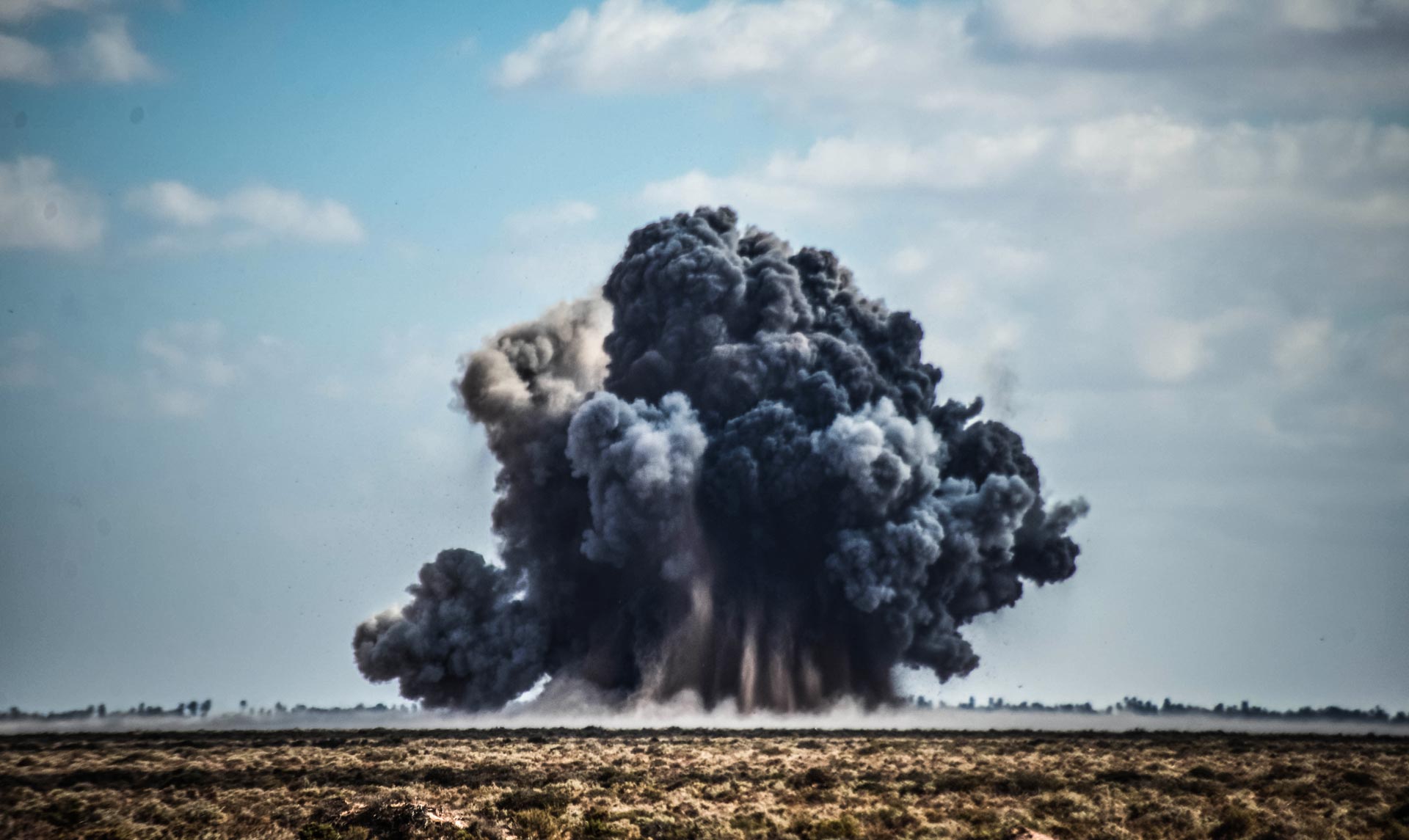 Controlled demolition explosion during GCS EOD operations in Libya, destroying recovered explosive ordnance.