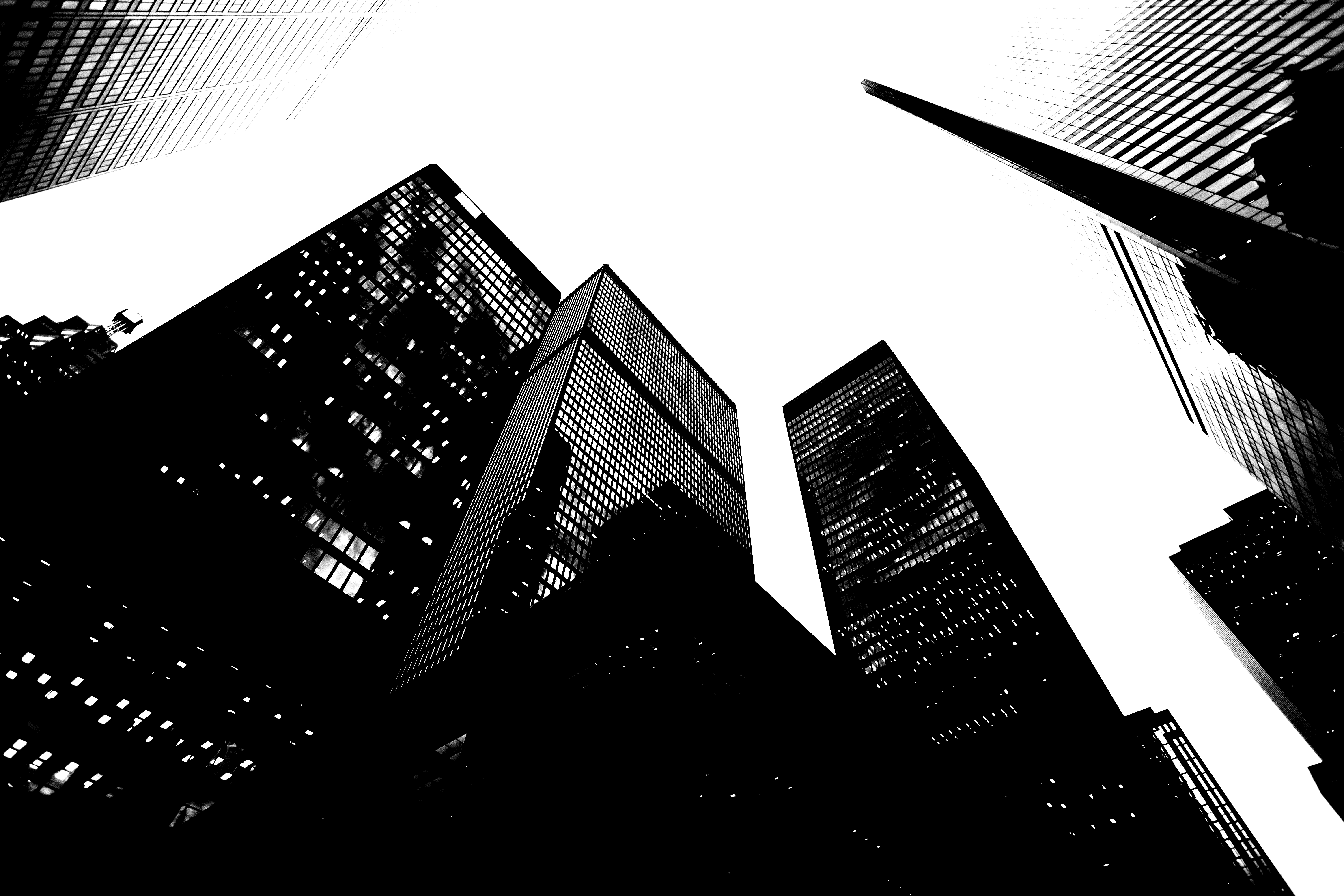 low angle photo of city high rise buildings during daytime