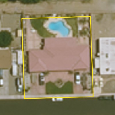 Aerial photo of a backyard pool in Yuma, with the lot outlined in yellow
