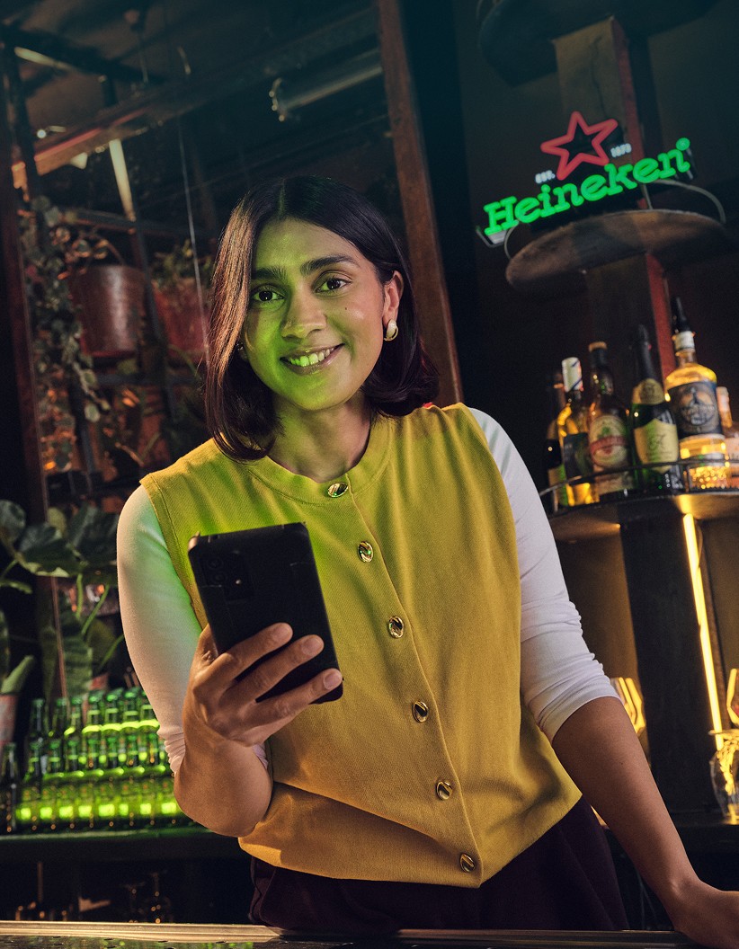 Restaurant owner with phone in hand