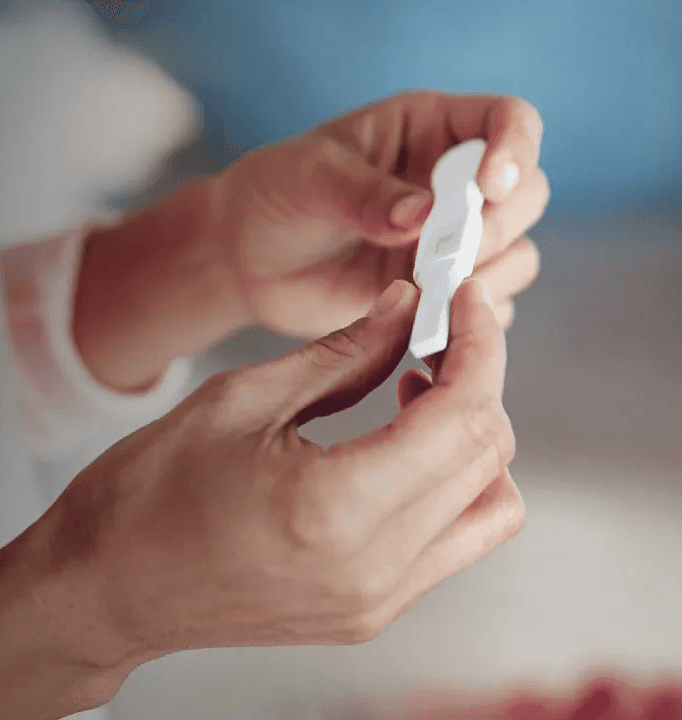 Woman checking pregnancy test after Flouria’s Fertility care path