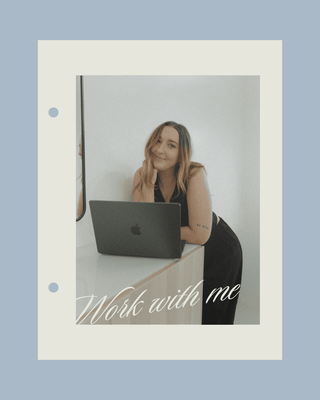 founder of Hoban Pro Motions, Emily leaning on table with laptop