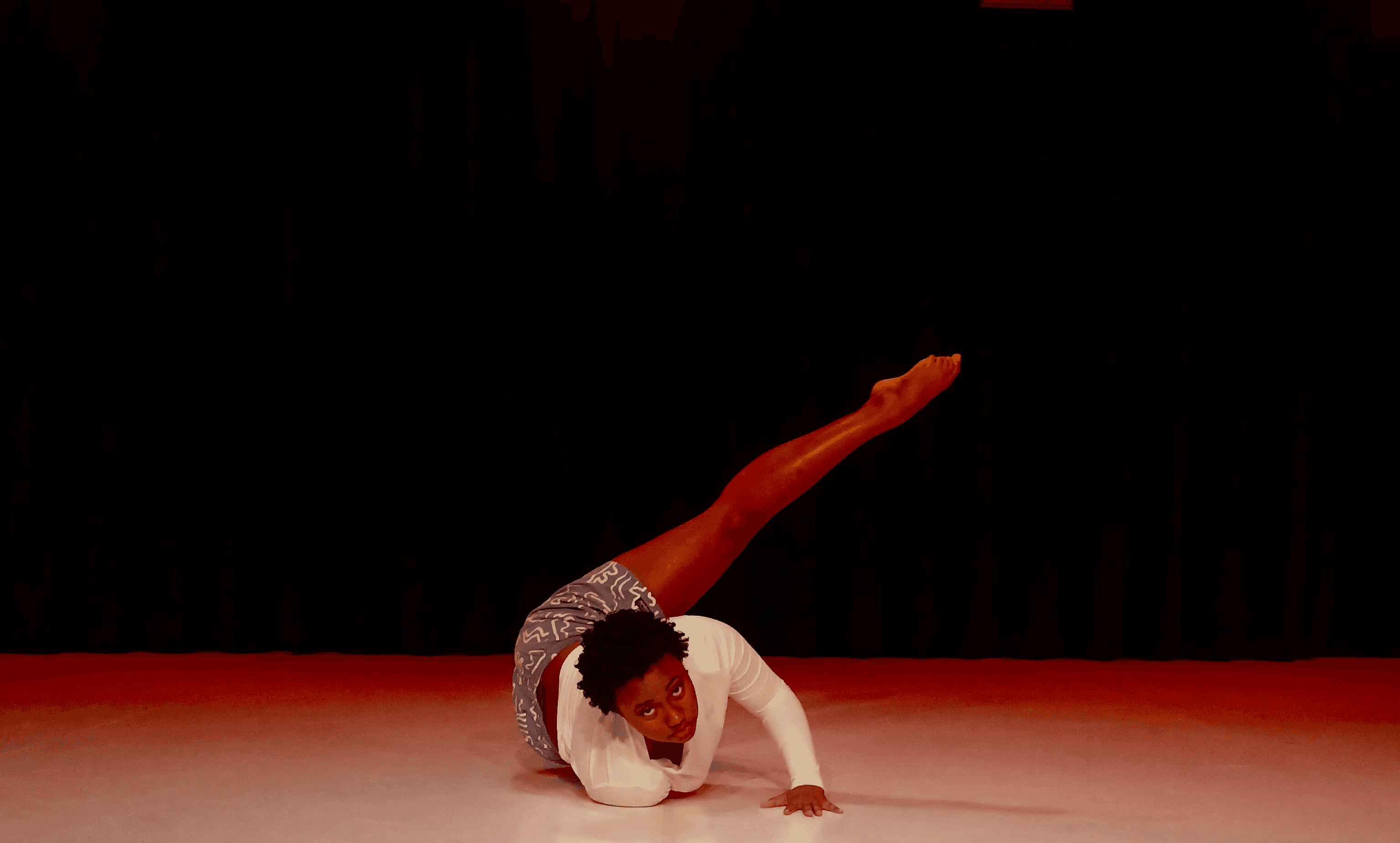 kids lying on a glass land and smiling