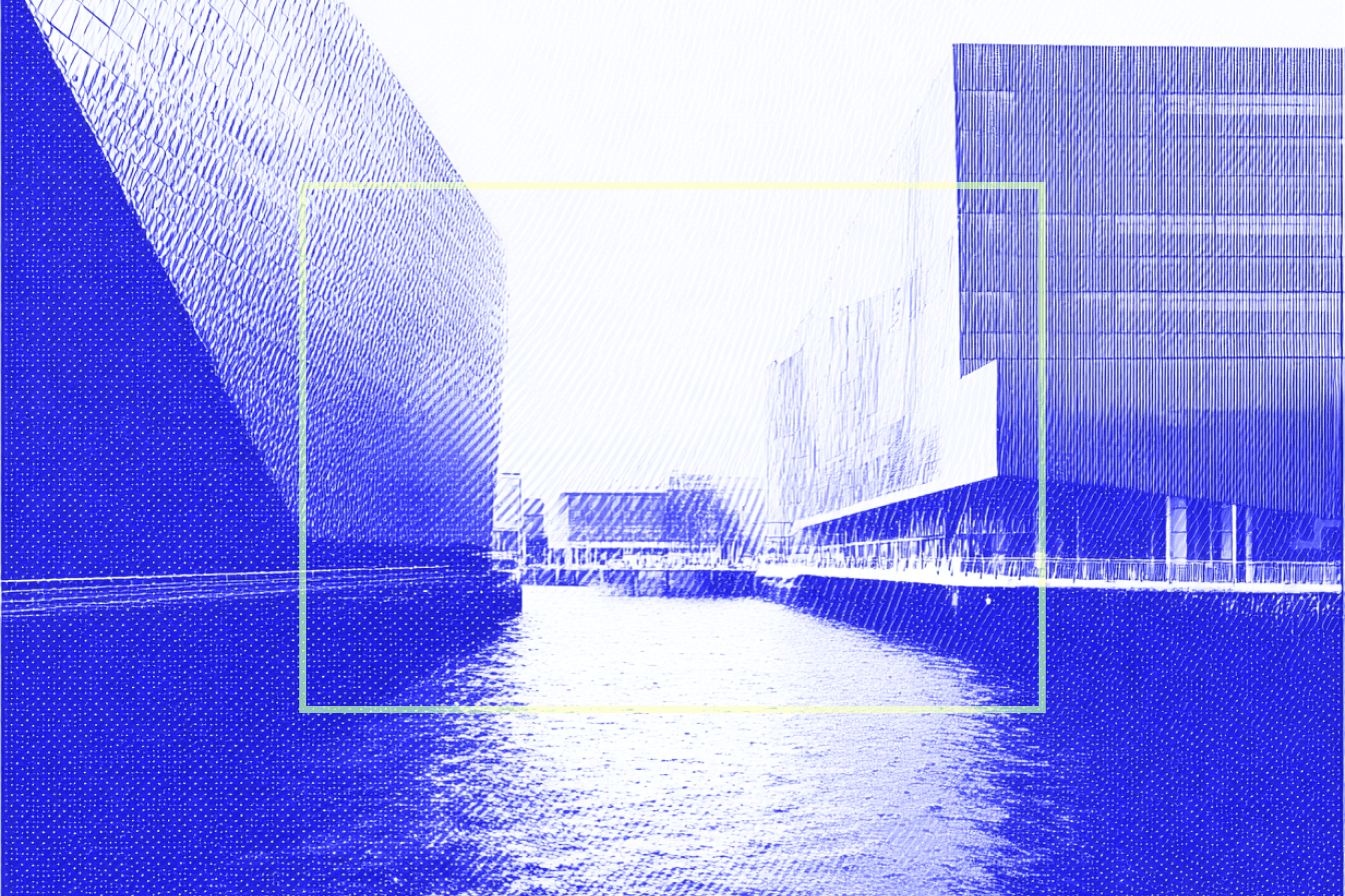 A digitally edited image showcases a modern architectural landscape with sleek, angular buildings reflecting off a calm waterfront, creating a futuristic setting.