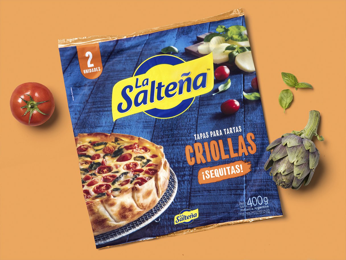 Rooftops of a coastal town with the sea in background