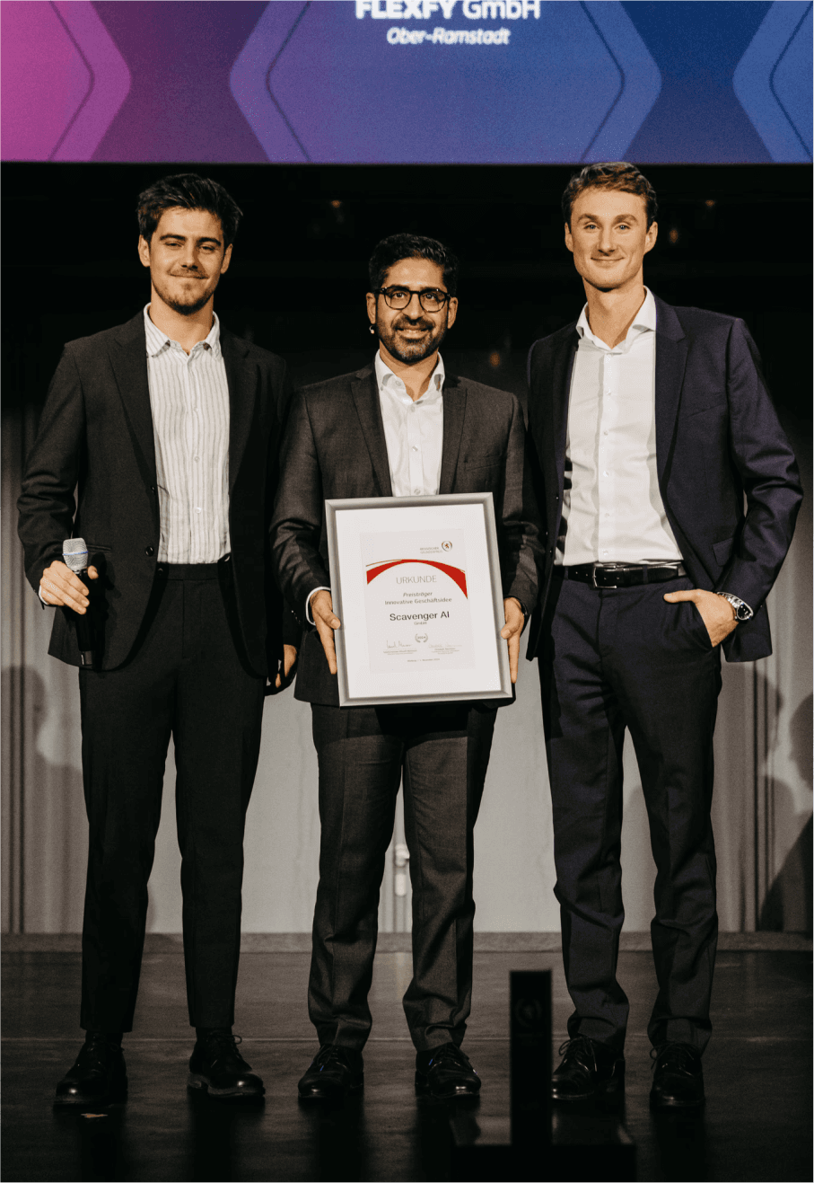 3 men with an award
