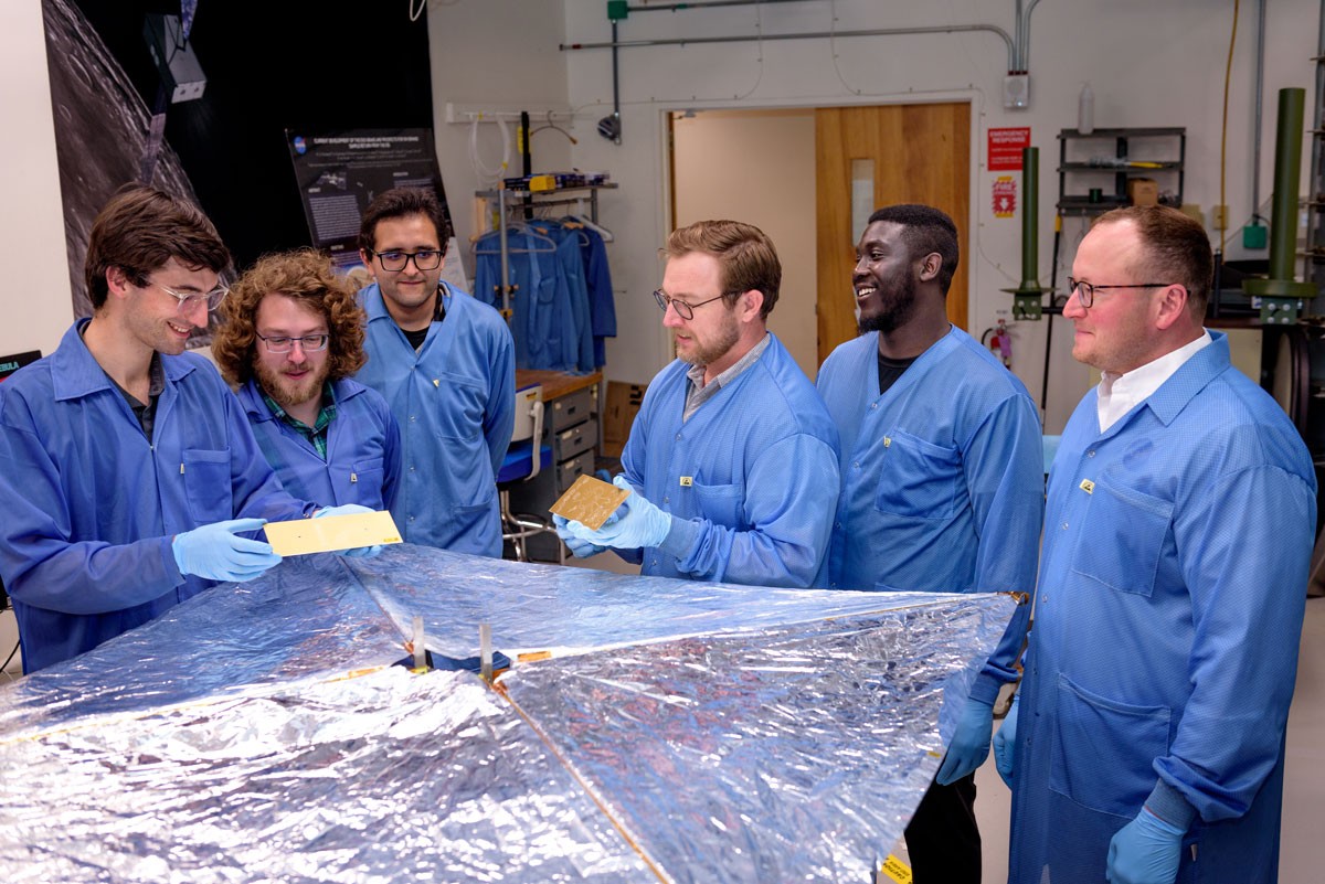 mission team posing with the artworks