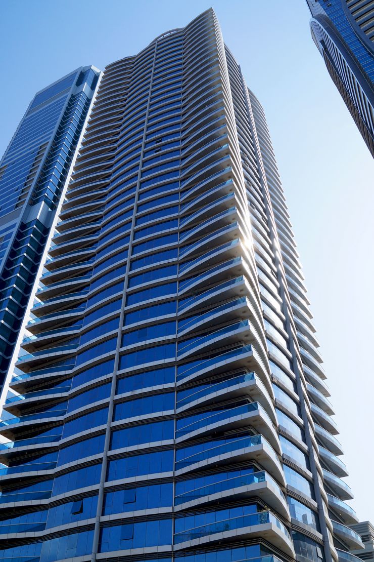 Falcon Tower glass facade view. Contact our real estate agent for premium apartment listings in this Dubai skyscraper.