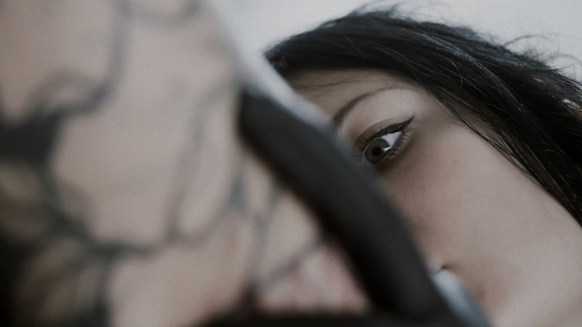 Cinematic art film frame of Yanina Viland working on a detailed tattoo