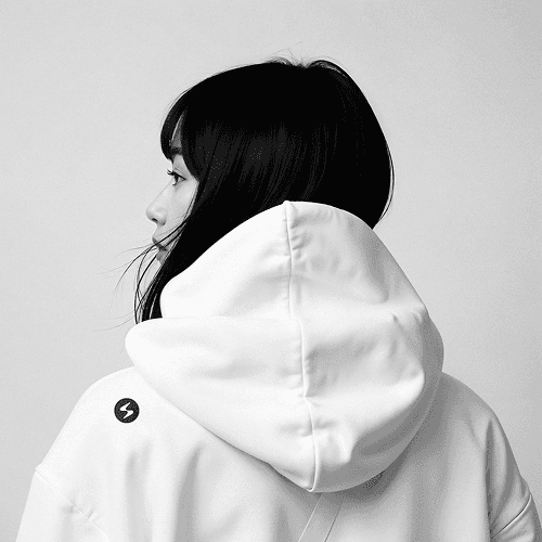 Branded hoodie worn by engineer, signaling team identity and brand lifestyle system