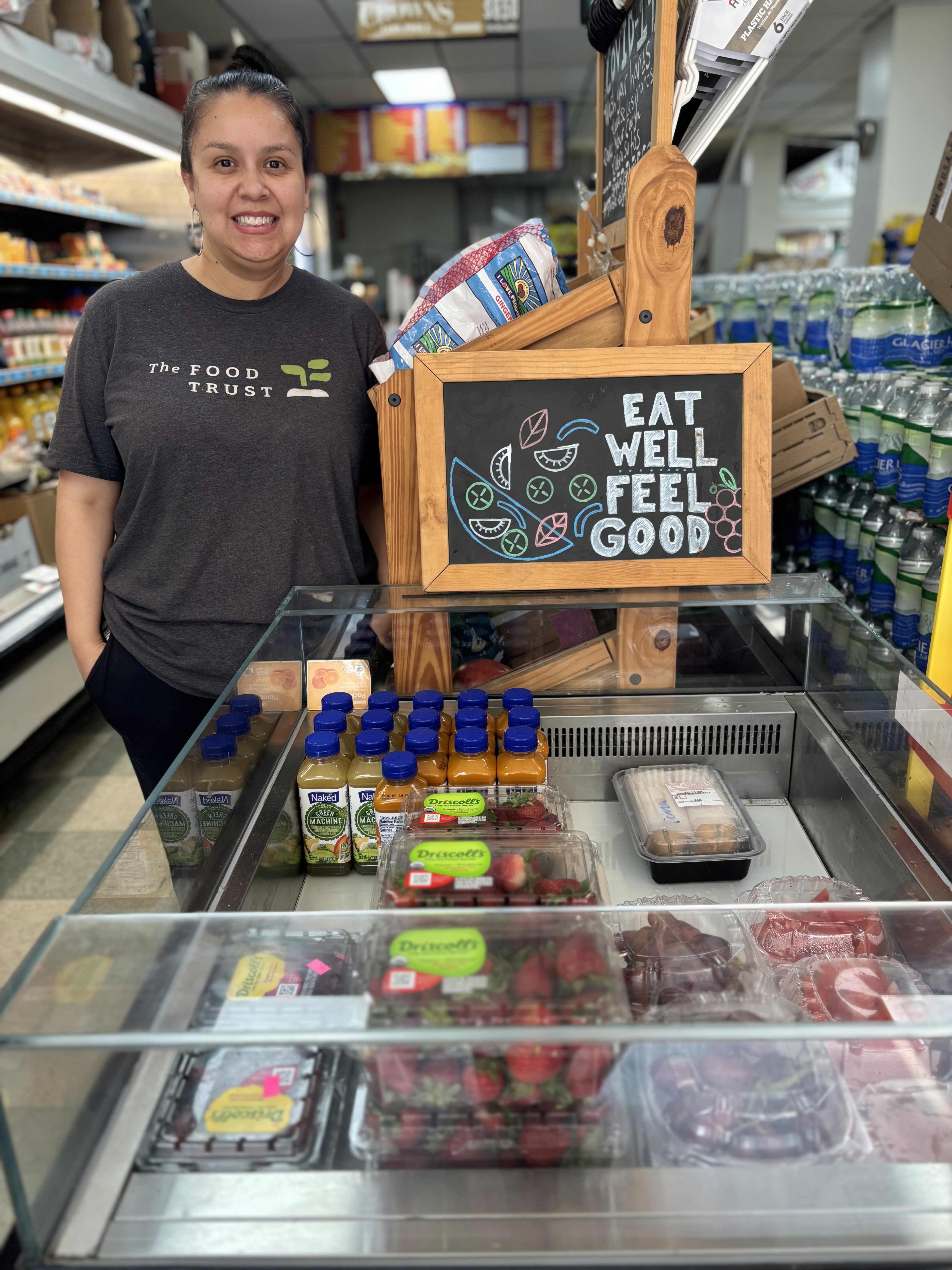 Person standing next to food display