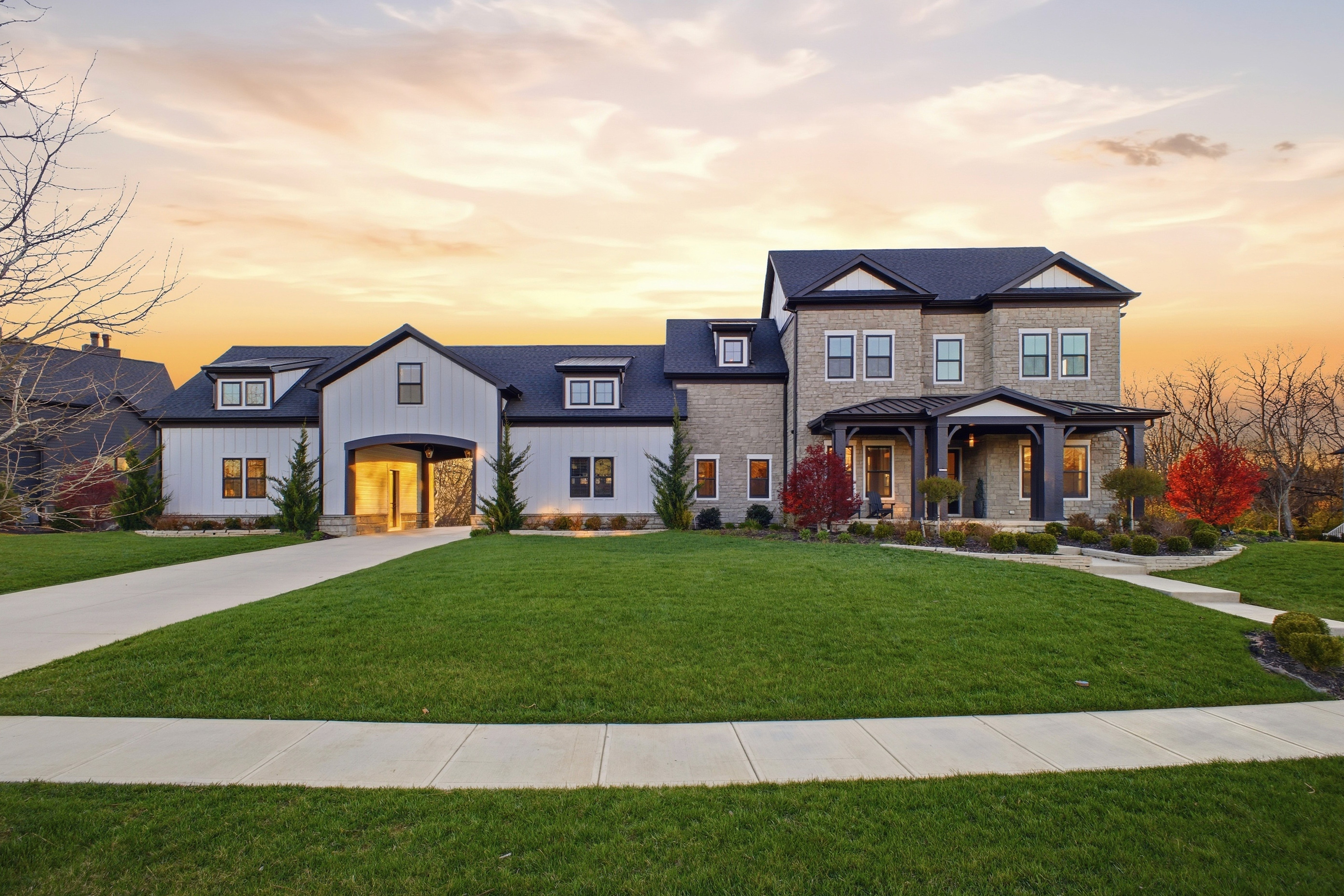 wide angle streetview of a luxury ohio home during golden hour
