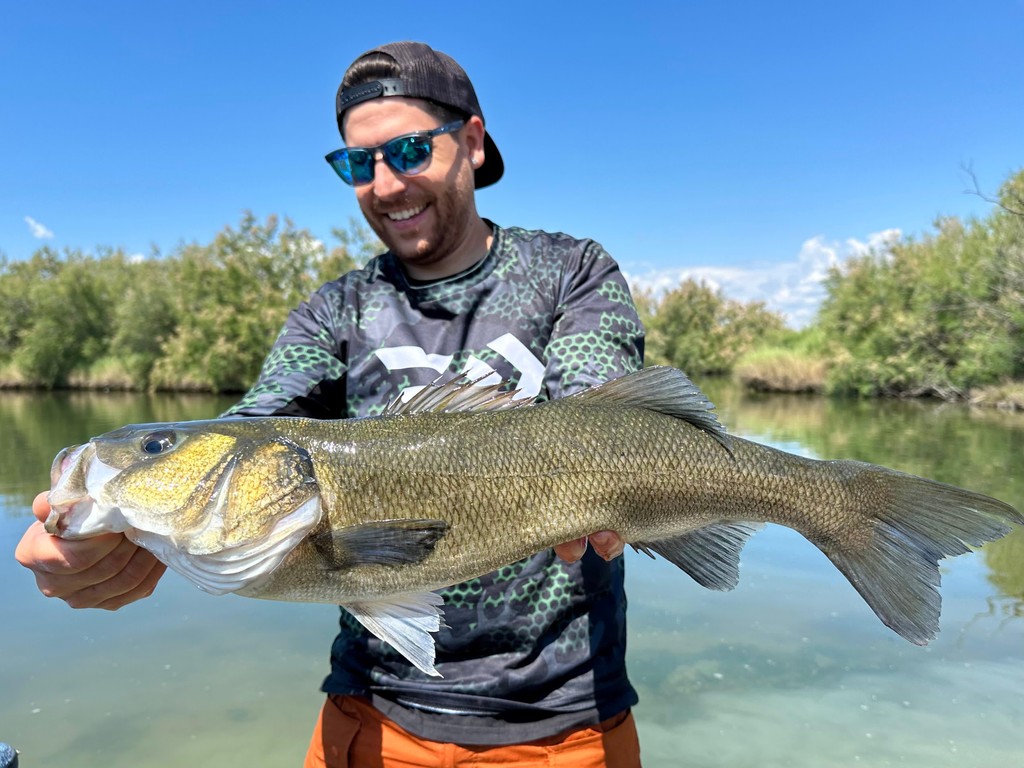 Fisherman using a 7ft spinning rod to target predators in the Valli Veneziane.