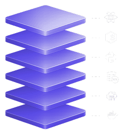 A talent recruiter with a soft smile working on her laptop in the office. The angle is on her face so we can't see what's is on the screen. She is wearing a blazer