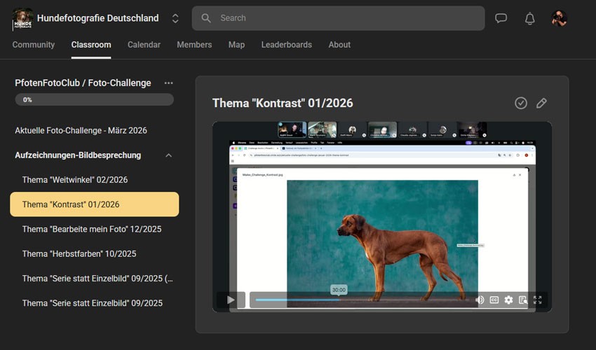 Aerial view of a winding road cutting through rocky terrain and sandy landscape.