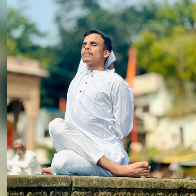 A person on a cozy studio smiling