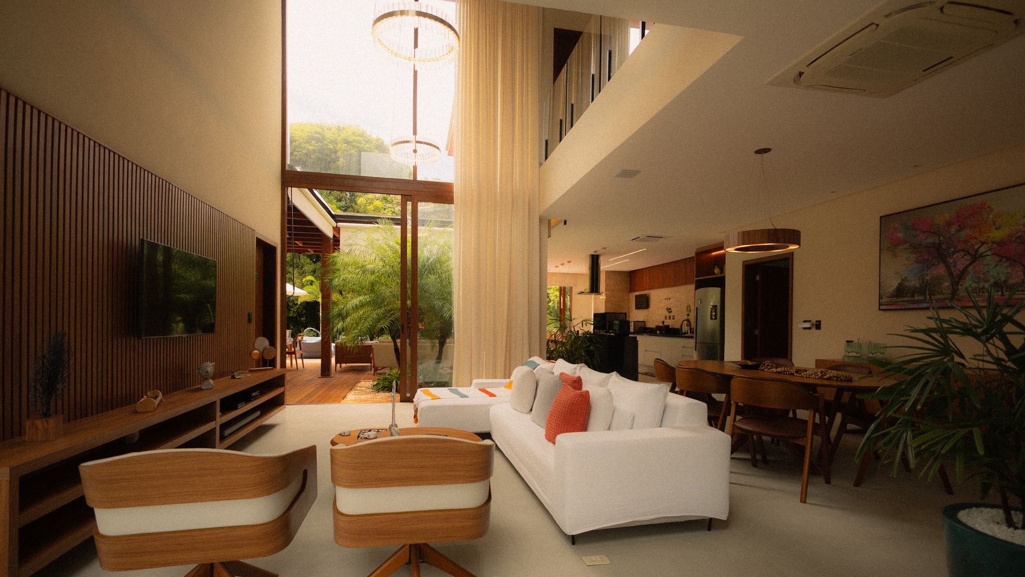 Double-height living room filled with natural light
