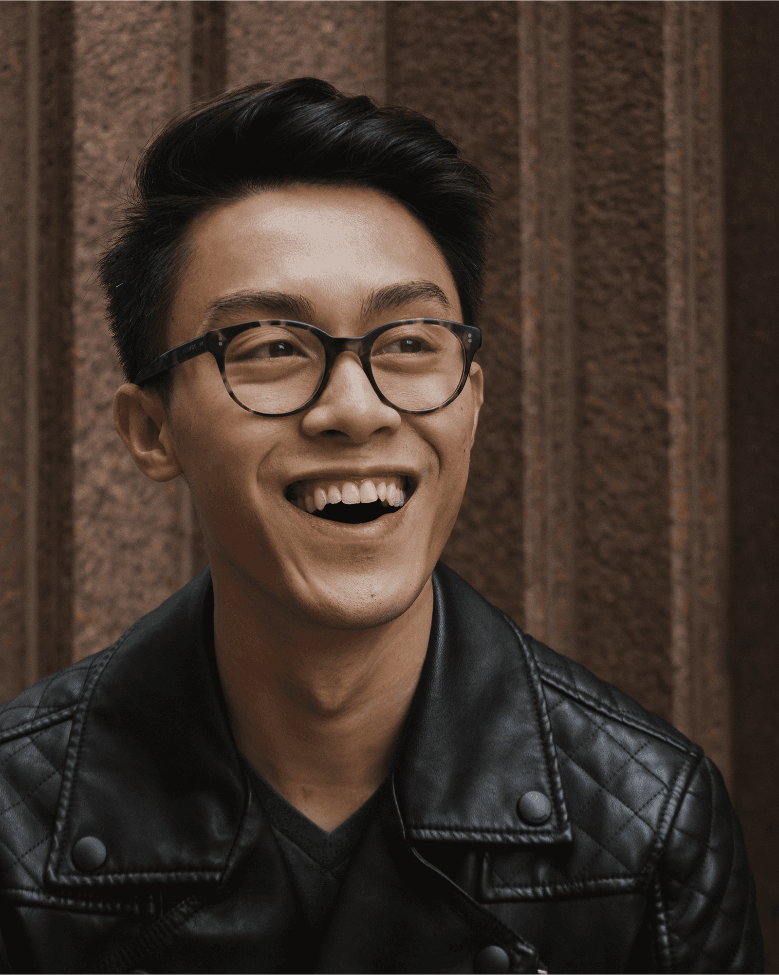 Headshot of Adam smiling