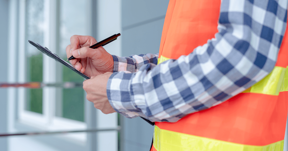 woman sitting around table holding tablet