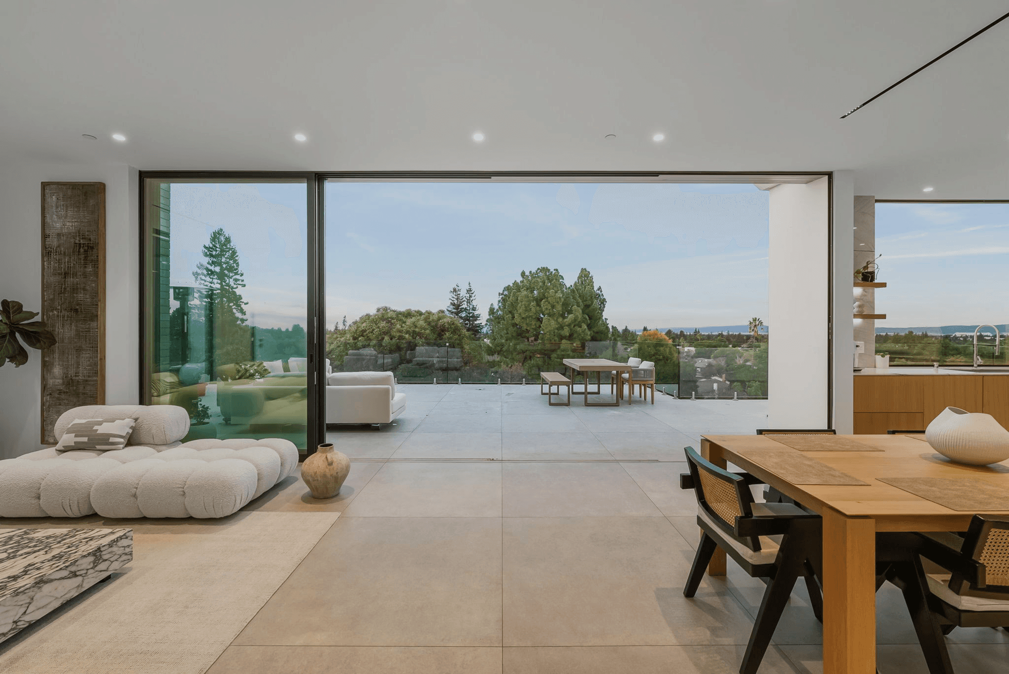 Exterior of the Open Frame Home in Menlo Park, California, featuring a modern two-story facade with large paneled windows and clean architectural lines.