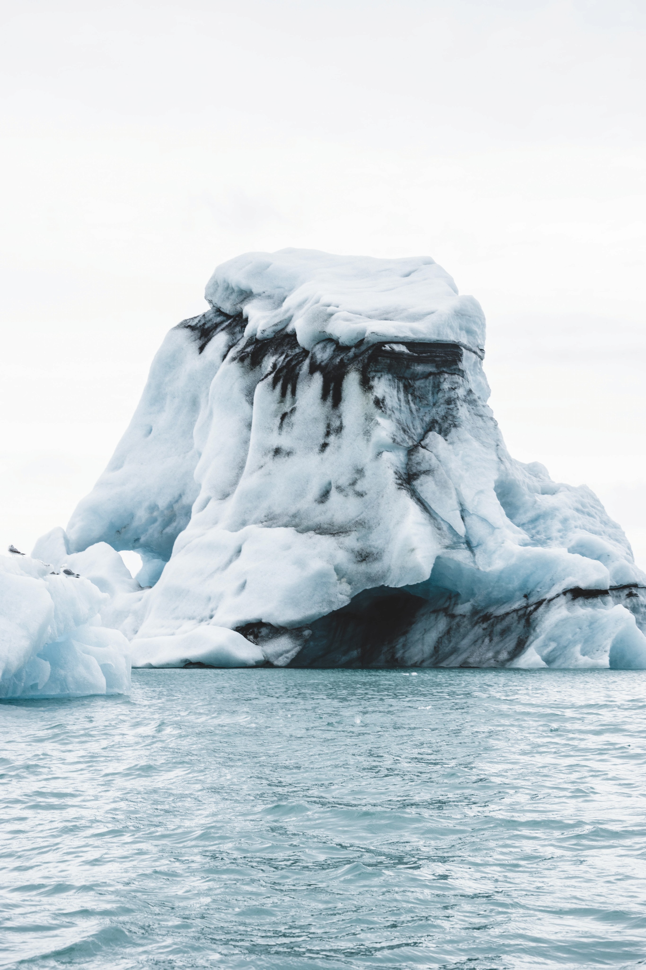 An iceberg in the middle of water