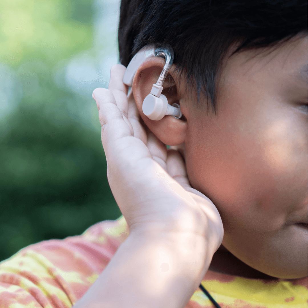 child with hearing aid