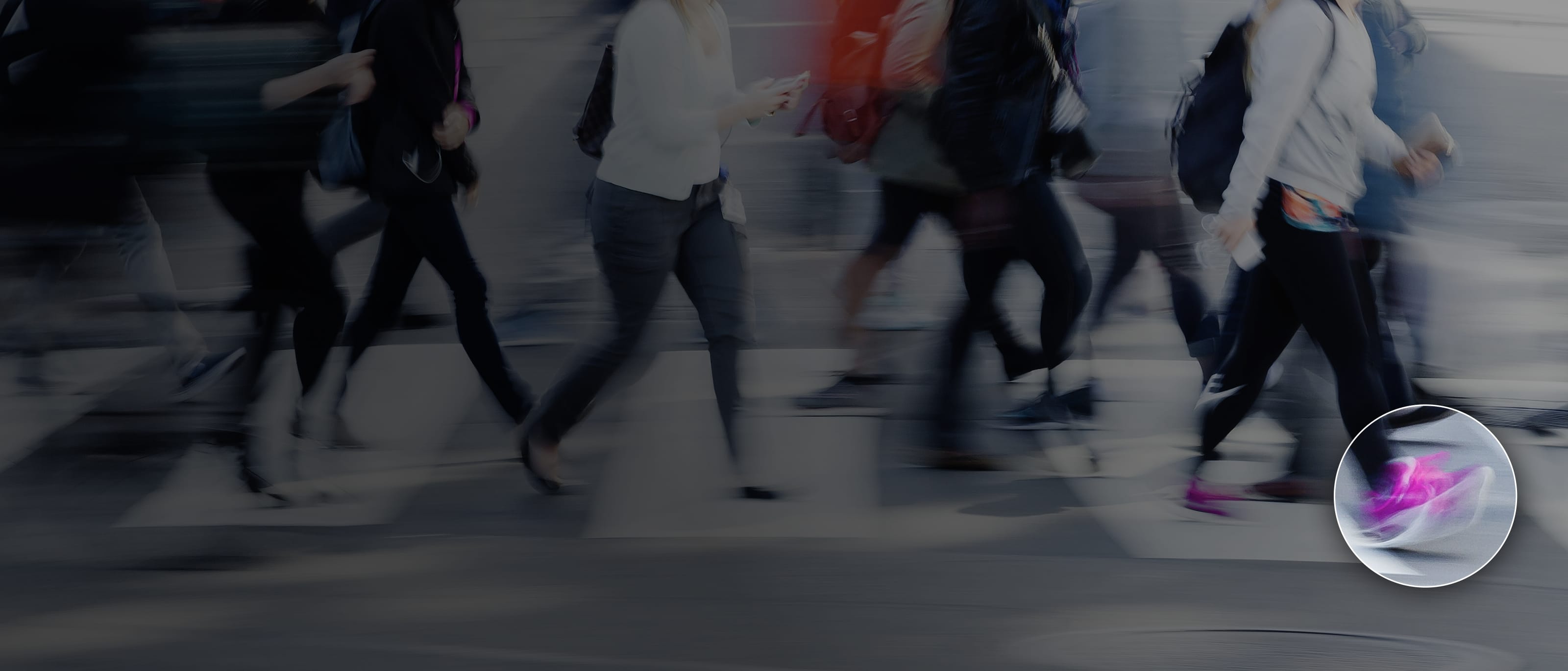 A busy high-street scene with blurry people and an overlay on a persons trainer suggesting computer vision