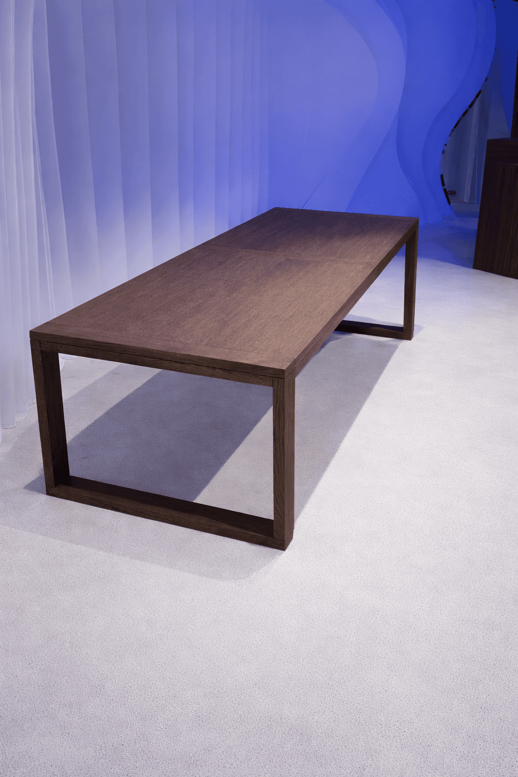 A vintage race car with blue, orange, and white livery