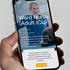 Hand holding a mobile phone showing an open position