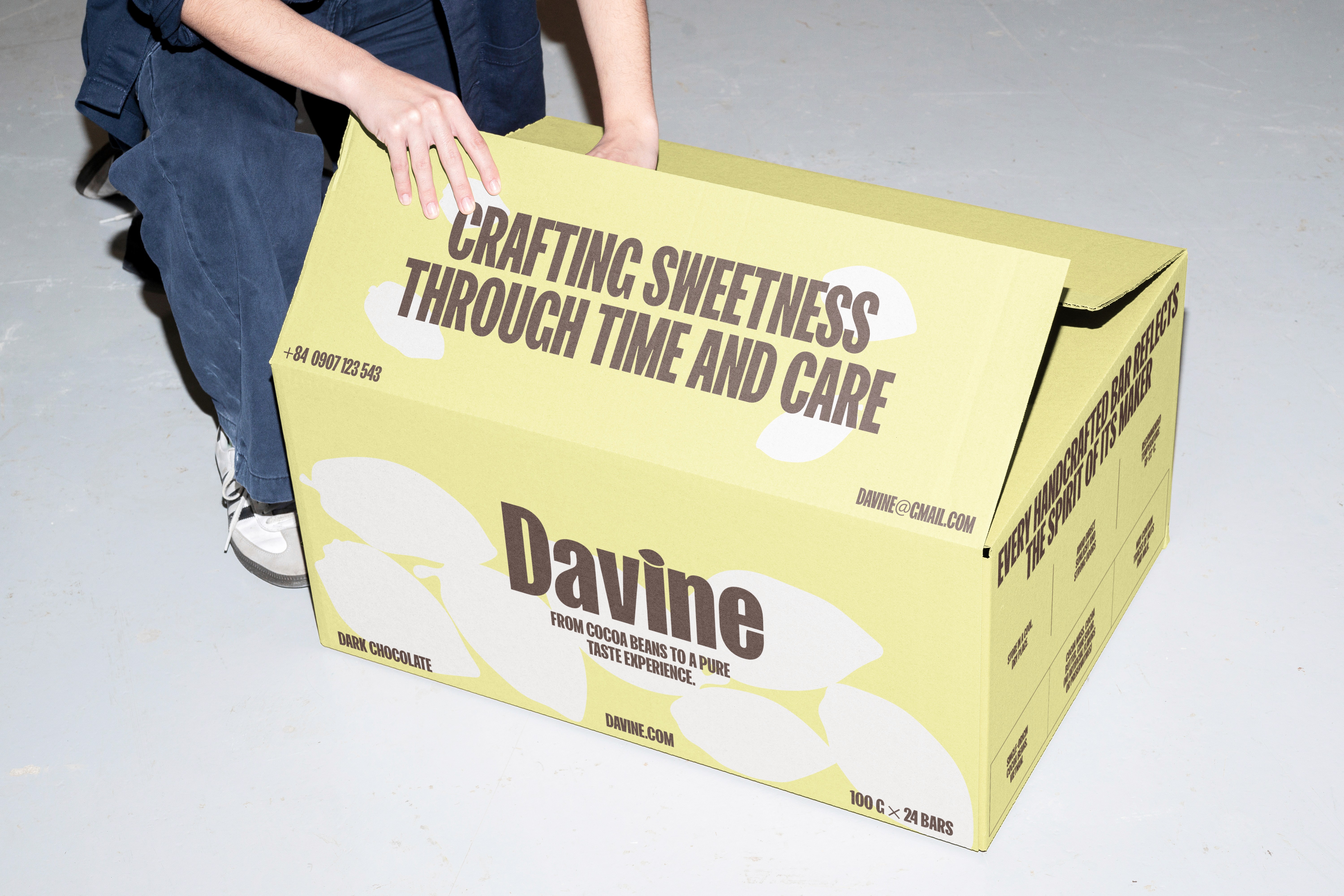 Stack of modern books and magazine with minimalist cover design on leather chair