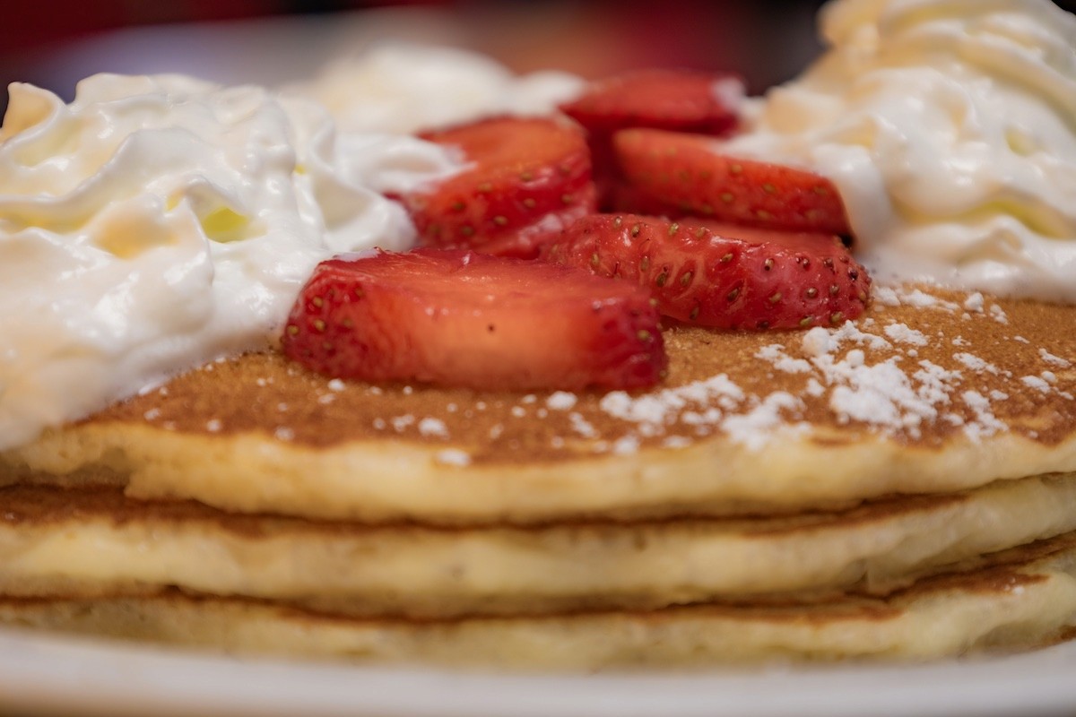 Pancakes with strawberries and whipped cream