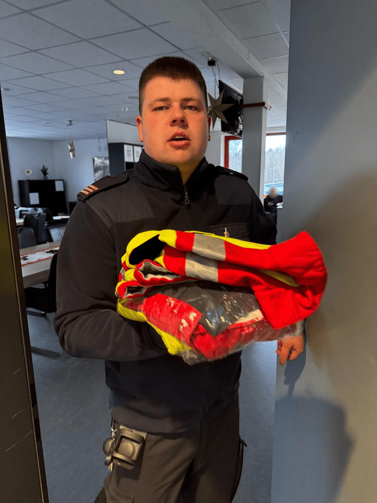 greyscale photo of woman in bralette inside room